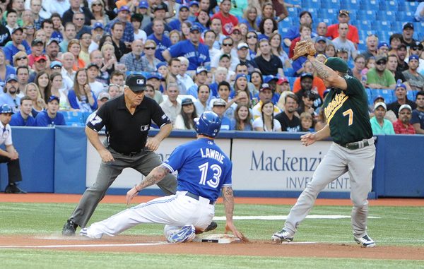 Toronto Blue Jays third baseman Brett Lawrie tagged from second base after a fly ball out but was thrown out at third by his Oakland Athletics counterpart Brandon Inge in the first inning. A big seventh inning propelled the A's to a 7-2 victory at the Rogers Centre on Tuesday night (Karan Vyas)